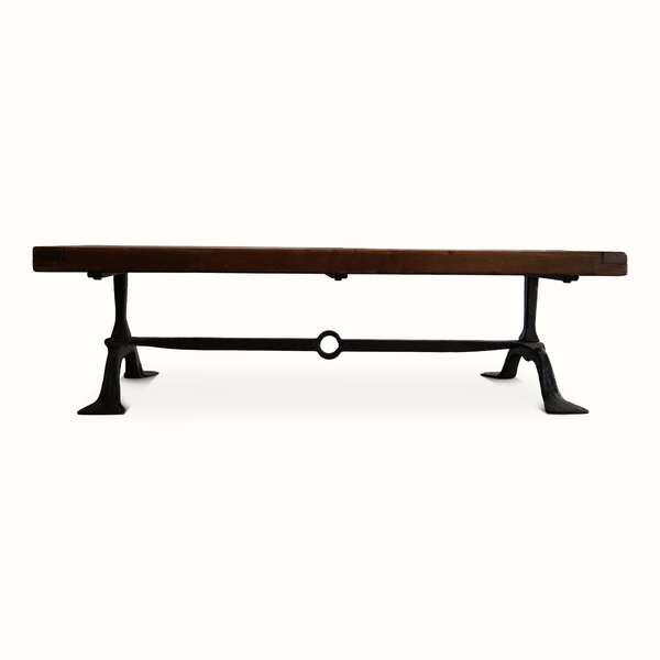 Coffee table low side view with oak top and dark forged iron frame, ring connector.