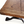 Oak coffee table tabletop close-up showing distressed grain and dark slate inset.