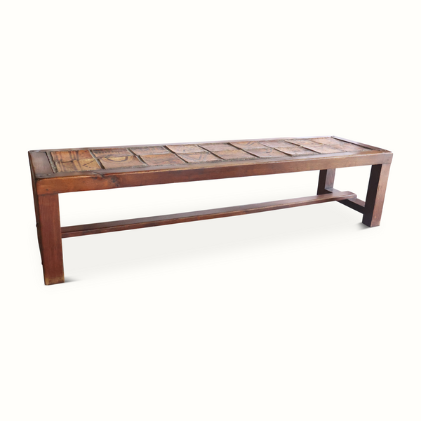 Wooden bench with decorative ceramic tile top and open lower frame