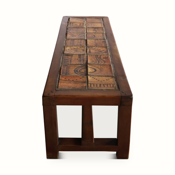 Wooden bench with decorative ceramic tile runner and open apron base