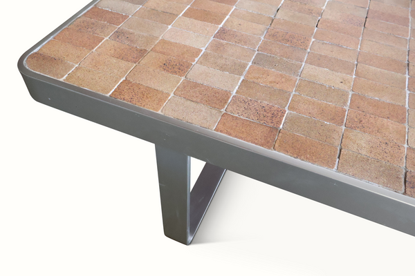 Tile coffee table side view with brown mosaic top and gray metal apron