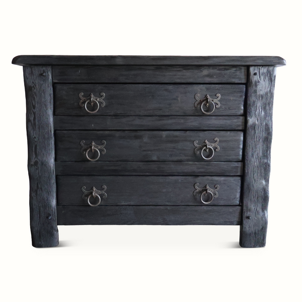 Front view of four-drawer ebonized oak chest with decorative metal knobs, dark finish