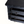 Close-up of ebonized oak chest drawers with ornate metal knobs, dark distressed wood