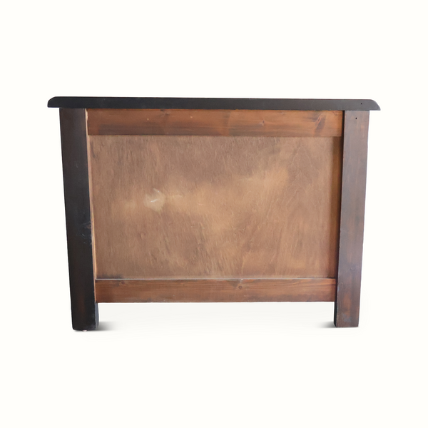 Ebonized oak chest back panel with smooth light wood surface and dark side frame