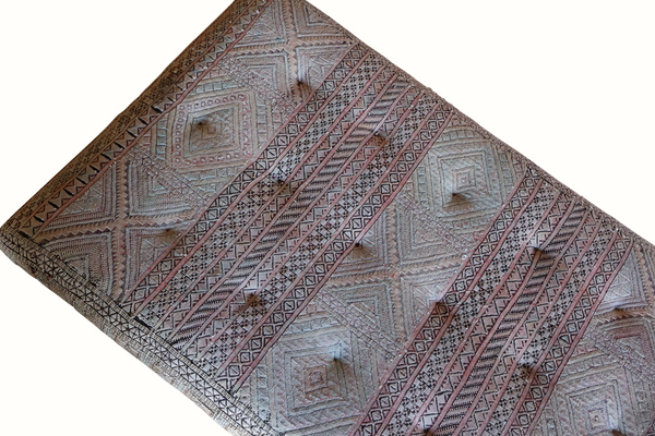 Tufted ottoman textile top panel with blue-gray geometric patterns and red trim