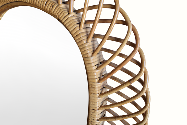 Bamboo mirror frame close-up: woven lattice around an oval edge