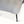Sheepskin armchair base close-up, cream seat edge with black legs and rounded feet