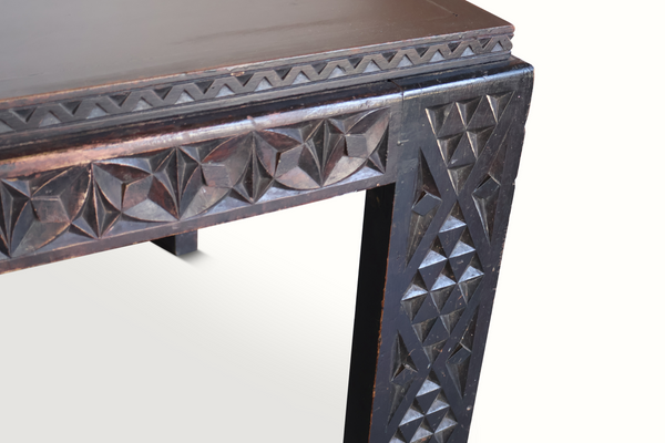 Antique Moroccan table top edge close-up with carved geometric border and wear