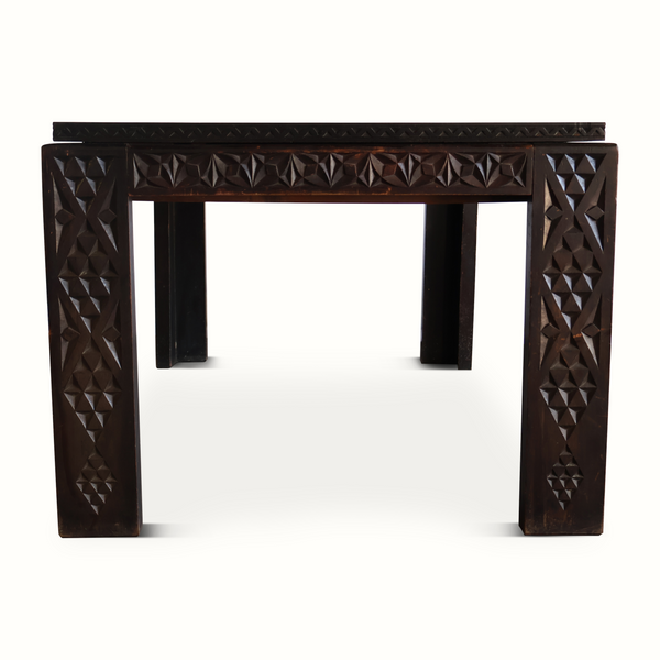 Antique Moroccan table centered front view with carved legs and textured diamond panels