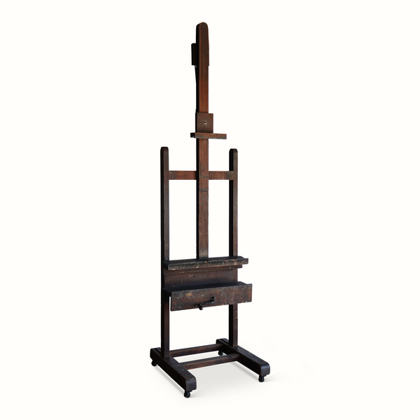 Antique wooden easel stand with adjustable arm and bottom platform on casters