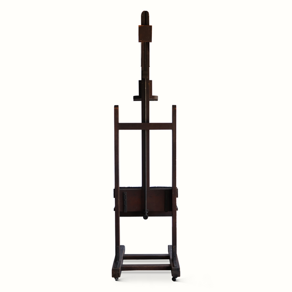 Antique wooden easel with front tray shelf and bottom platform on casters