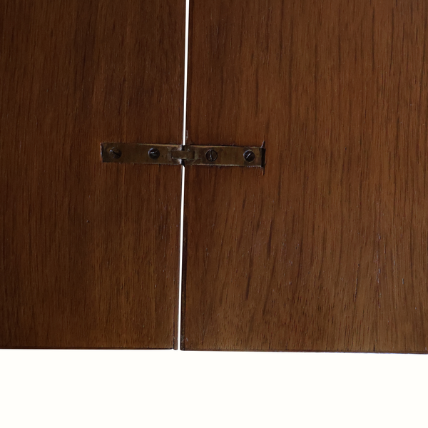 Oak flip-top game table hinge with metal latch, showing the split join