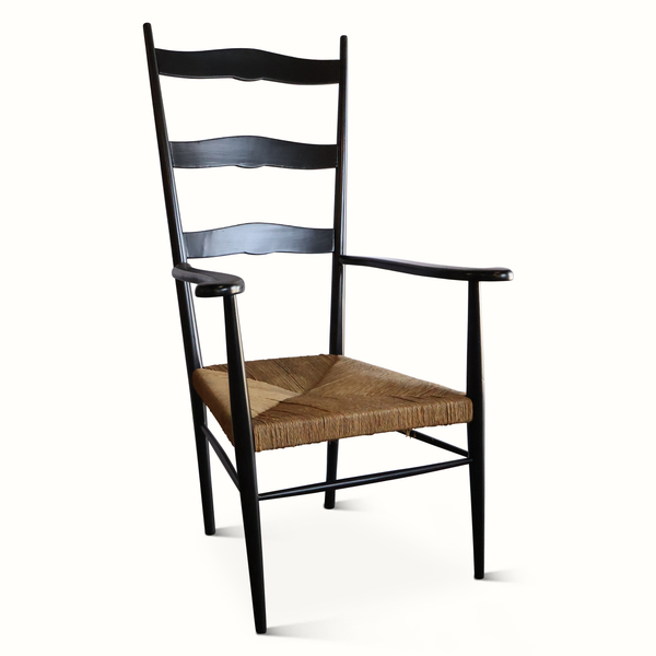 Rush armchair with black frame, wavy back slats, and woven brown square seat