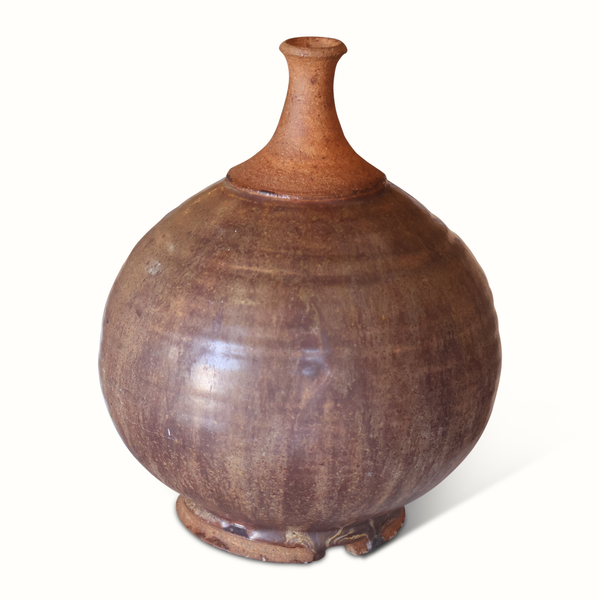 Handmade pottery vase with bulbous body and narrow neck; mottled rust-brown glaze.