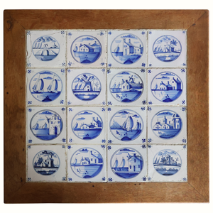 Wooden tabletop with blue-and-white Delft tile panel and circular coastal scenes