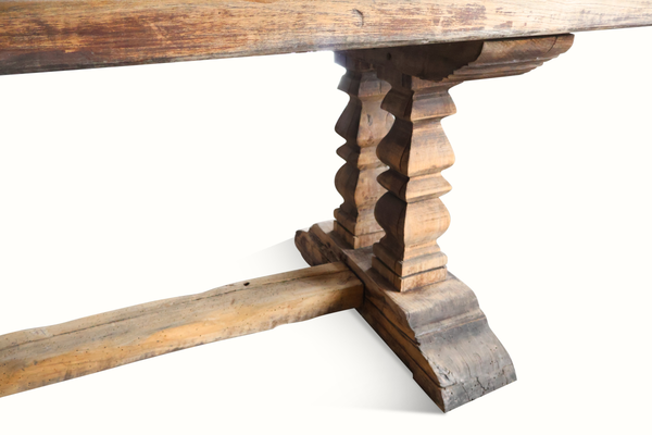 Farm table leg detail with turned posts and dark stained base support beam