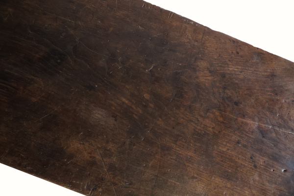Carved oak table top board with dark brown worn patina and visible wood grain