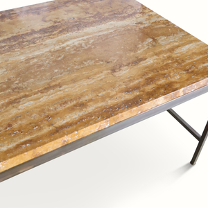 Brown stone coffee table top with speckled veining and dark metal edge