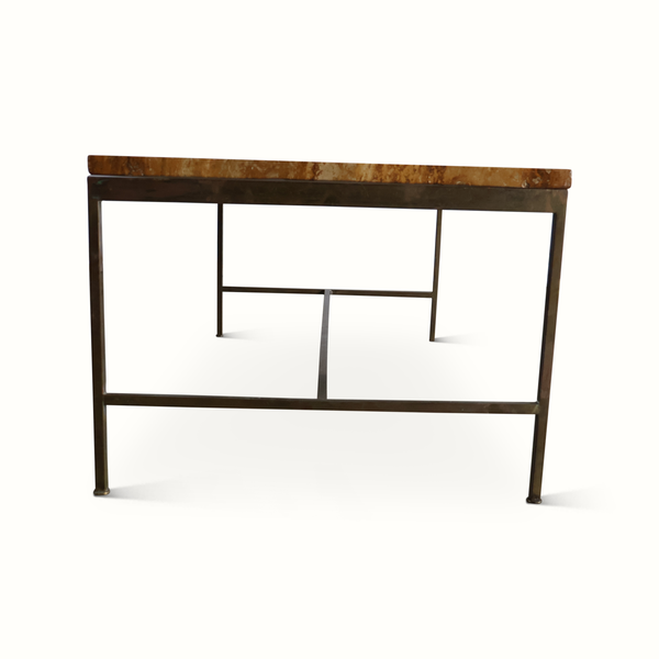 Coffee table with brown stone top, dark metal frame, and geometric openwork