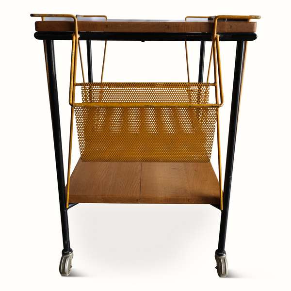 Bar cart with wood shelves, black legs, and perforated brass-toned front basket