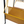 Perforated brass-toned basket on bar cart, mounted to black-and-brass frame