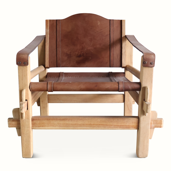 Safari armchair with brown leather back and seat, stitched panels, and light wood frame