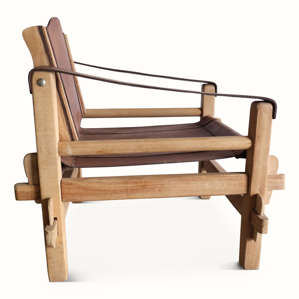 Safari chair side view with dark leather seat cushion and back, wood slat arm supports