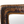 Vintage copper mirror frame close-up, textured top border and rounded corners