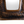 Vintage copper mirror frame close-up, textured lower border with arched cutout