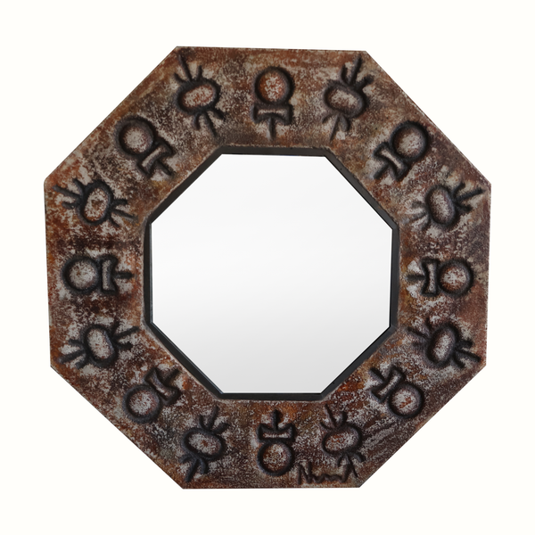 Octagonal ceramic mirror with bronze-toned frame and etched flower motifs