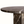 Close-up of round dark marble tabletop edge with white veining on column base