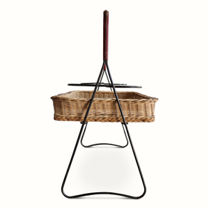 Wicker mirrored top tray table with black iron legs and dark red leather handle, front view
