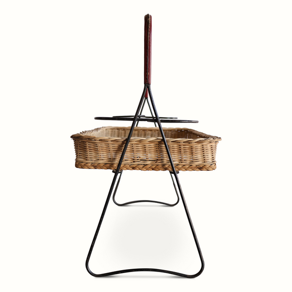 Wicker mirrored top tray table with black iron legs and dark red leather handle, front view
