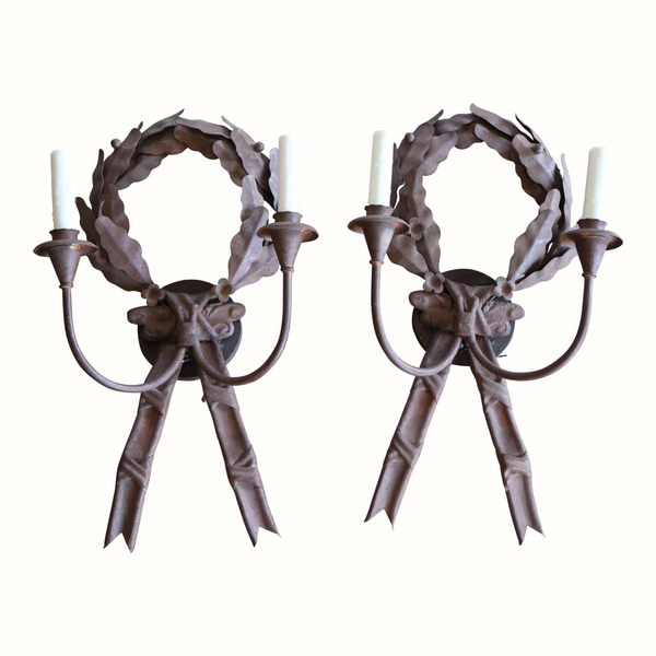 Pair of dark metal wreath wall sconces with scalloped leaf ring and ribbon bows