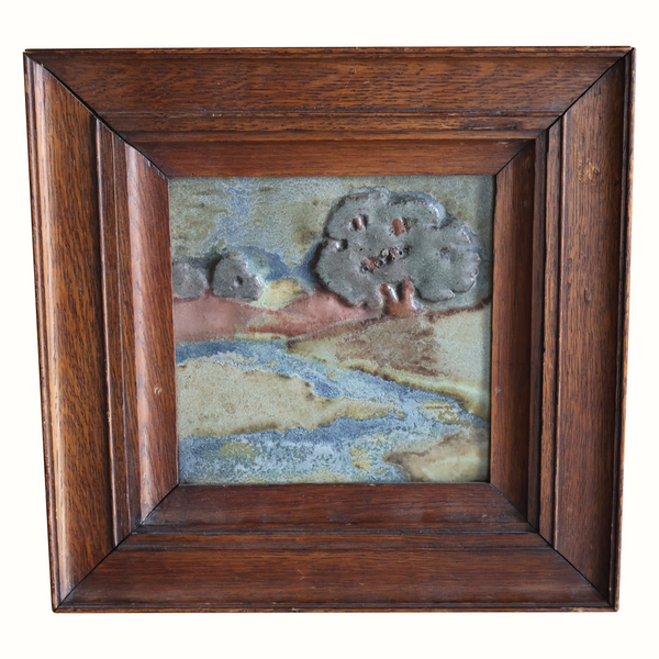 Scenic landscape pottery tile with raised details, dark wood frame and blue water scene