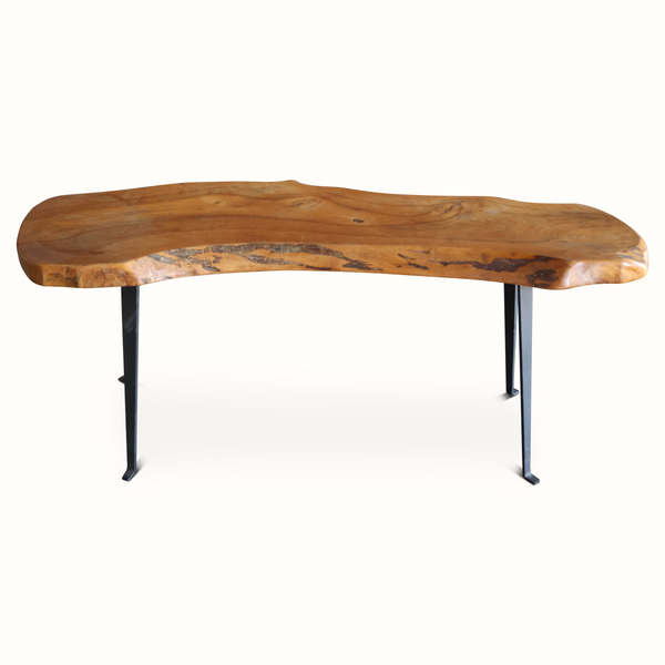 Live edge wooden table with curved slab top and black metal hairpin legs