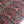 Close-up of vintage Persian carpet-style upholstery fabric in red, blue, and cream