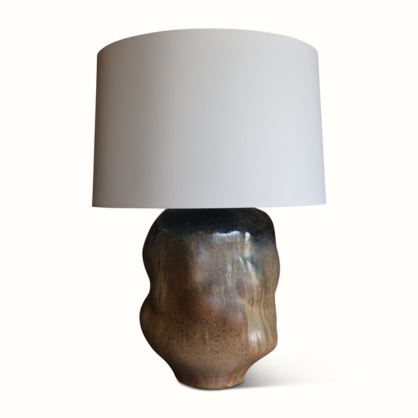 Brown glazed ceramic studio pottery table lamp with off-white drum shade