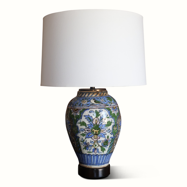 Floral ceramic vase table lamp with white drum shade and blue-green pattern, dark base