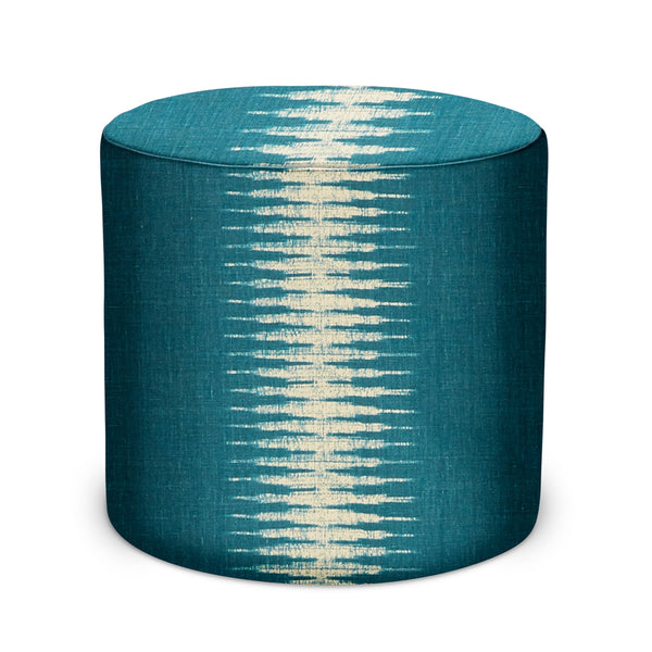 Round indoor pouf with teal ikat fabric and light stripe pattern