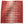 Peter Dunham ikat pillow cover in pomegranate red with cream abstract stripe pattern