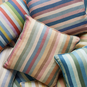 Set of striped throw pillows in pastel tones, close-up angled view