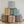 Multicolor striped indoor pouf set with six cylindrical ottomans