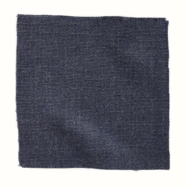 Indigo woven indoor/outdoor pillow with solid textured front