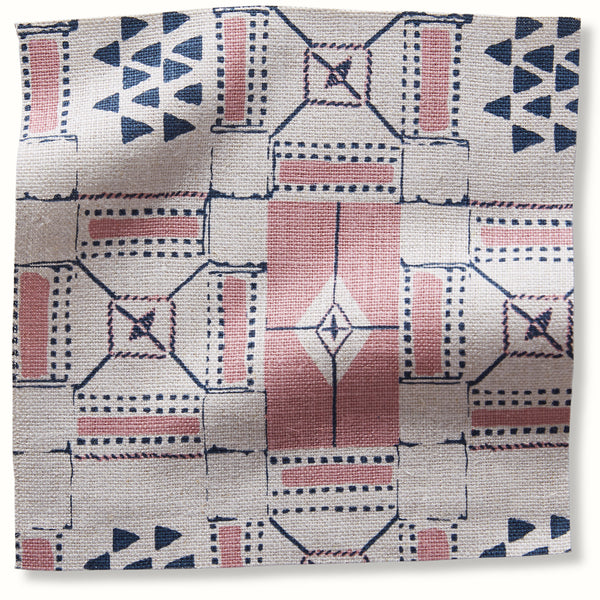 Geometric patterned pillow cover in pink and indigo
