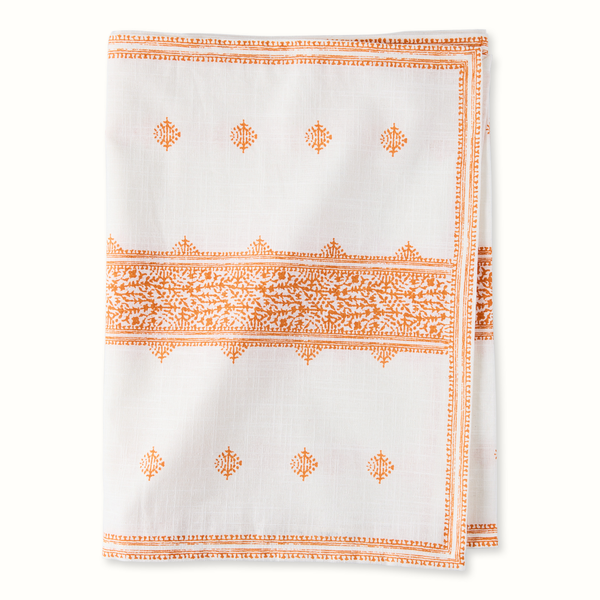 Orange-and-white printed runner with border stripes and repeating medallion motifs