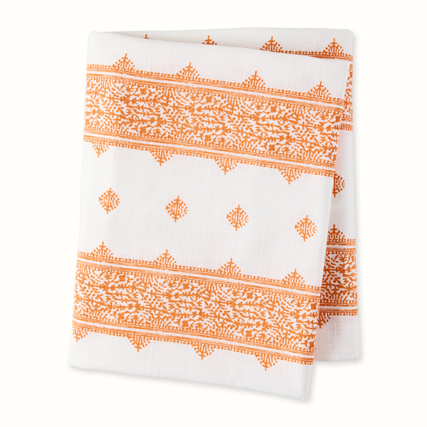Printed tablecloth in white with orange fez stripe pattern and medallion motifs