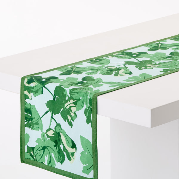 Green leaf-printed runner with pale blue base and stitched border