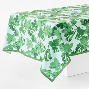 Leaf-printed tablecloth with pale blue base and green botanical pattern