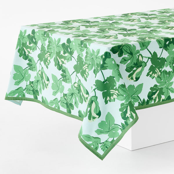 Leaf-printed tablecloth with pale blue base and green botanical pattern